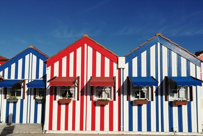 Aveiro and Coimbra Small Group Tour with Moliceiro Boat Cruise - Costa Nova: The Colorful Coast Stop That Breaks Up the Day