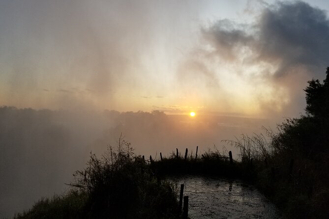 Guided Falls Tour & Zambezi River Cruise Combo - Day 2 at 7:00 am: Victoria Falls rainforest viewing with 15 guided stops