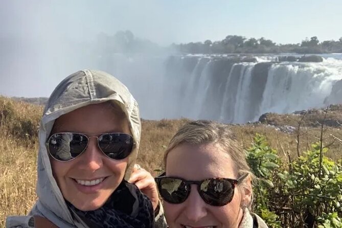 Guided Falls Tour & Zambezi River Cruise Combo - The baobab, Livingstone statue, and the bridge: key landmarks that anchor the story